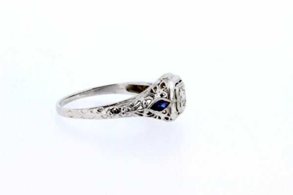 Timekeepersclayton 1920s 18K White Gold .11ct Diamond ring with Blue French Cut Accents with Flowers and Filigree