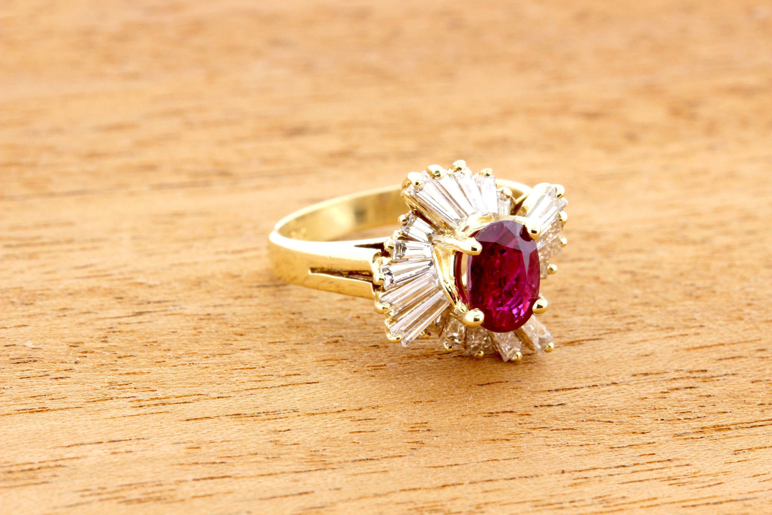 Breathtaking 18K Yellow Gold Oval Cut Ruby with White Baguette